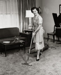 Portrait of a Young Woman Vacuuming Carpet Poster Print