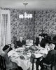 High angle view of a family praying at a dining table on Thanksgiving Day poster print.
