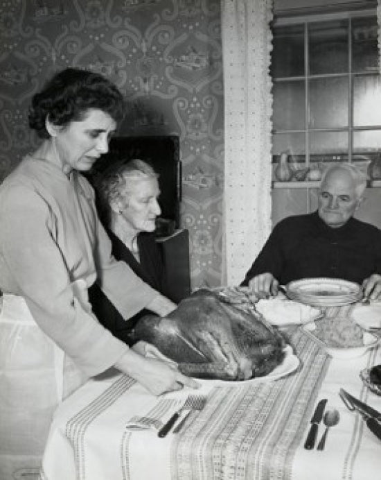 Thanksgiving Day poster print featuring a mature woman serving roasted turkey to her parents.