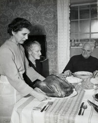 Thanksgiving Day poster print featuring a mature woman serving roasted turkey to her parents.