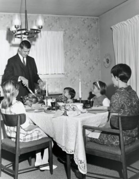 Thanksgiving Family Gathering Poster Print featuring a mature couple with their children at a dining table.