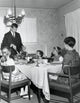 Thanksgiving Family Gathering Poster Print featuring a mature couple with their children at a dining table.