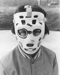 Portrait of a boy wearing a goalie mask poster print