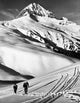 Poster print of two people skiing on a snow-covered landscape in British Columbia, Canada