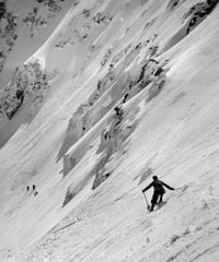 Man skiing on slope poster print showcasing dynamic winter sports action.