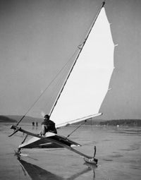 Man sailing an ice boat on a frozen lake poster print.