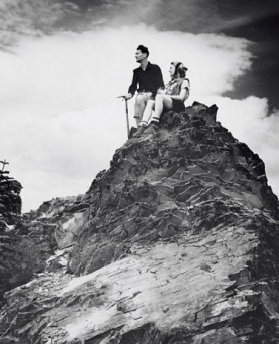 Young Couple Sitting on a Mountain Poster Print