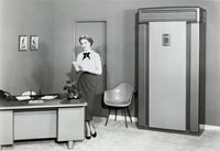 Portrait of a businesswoman holding a notepad in an office setting.