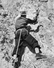 Rear view of a man climbing a mountain in Jackson Hole, Wyoming poster print.