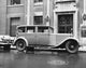 Rolls Royce parked on the road poster print showcasing luxury and elegance.