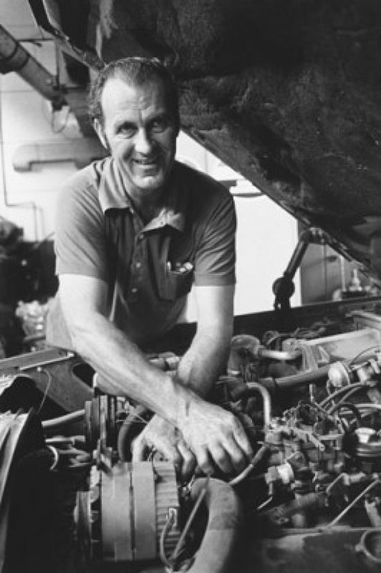 Auto mechanic repairing a car poster print
