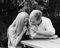 Teenage couple sharing a bottle of soda poster print