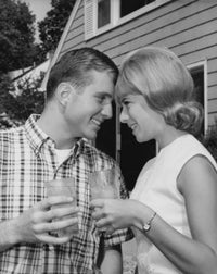 Close-up poster print of a young couple toasting with glasses of soda.