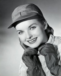 Portrait of a young woman smiling with hands on chin poster print