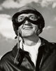 Close-up of a smiling pilot poster print, showcasing vibrant colors and joyful expression.