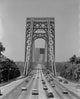 Suspended bridge with driving cars and American flag poster print.