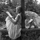 Mother and daughter sitting on ledge reading books poster print