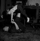 Grandfather playing with granddaughter on carpet poster print