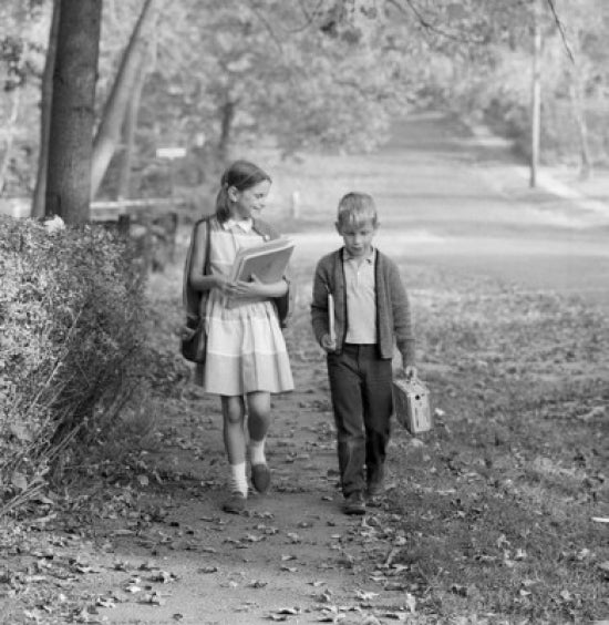 Boy and girl walking to school poster print