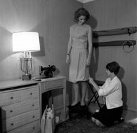 Dressmaker Fixing Dress Poster Print showcasing artistry in fashion.