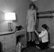 Dressmaker Fixing Dress Poster Print showcasing artistry in fashion.