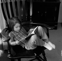 Girl Reading a Book Poster Print - Serene wall art for home decor.