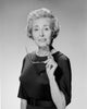 Portrait of Senior Woman Holding Glasses Poster Print