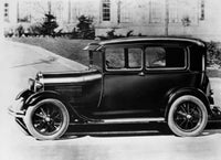 1929 Vintage Car Poster Print showcasing a classic automobile in front of a building.