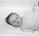 Baby Girl in Crib Poster Print showcasing a serene baby sleeping.