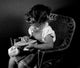 Embroidering Girl Sitting Poster Print showcasing creativity and artistry.