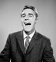 Young Businessman Laughing Poster Print - Motivational Artwork for Office