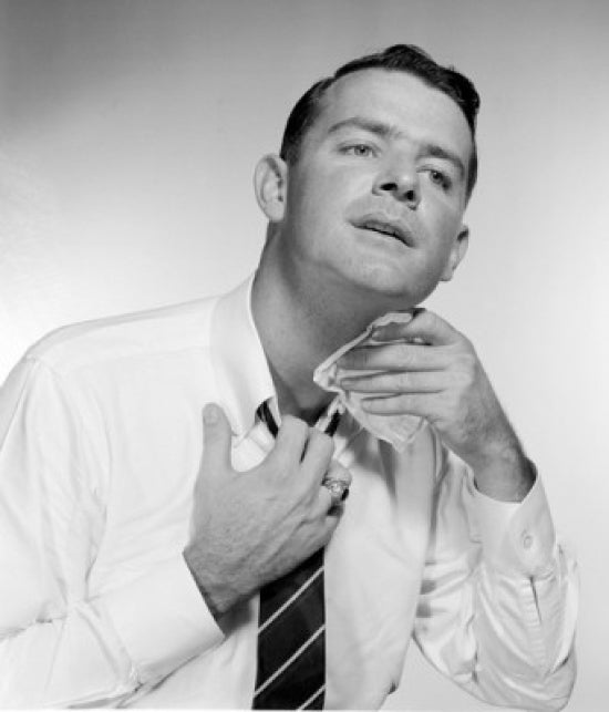 Businessman wiping neck poster print in studio shot, ideal for office decor.