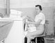 Woman Sitting and Folding Towers Poster Print - Art for Home Decor