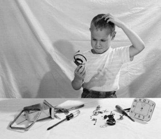 Boy in Thoughts Holding Clock's Parts poster print on premium paper.