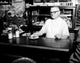 Boston Restaurant Scene Poster Print featuring a man serving guests
