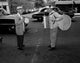 Two senior men playing on street poster print showcasing friendship and joy.