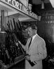 Man choosing airgun in shop poster print, perfect for enthusiasts and collectors.