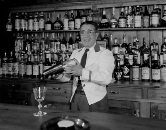 Mature Bartender Shaking Cocktail Poster Print showcasing a skilled bartender mixing drinks.