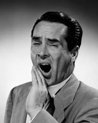 Portrait of Mid Adult Man Yawning Poster Print on heavy stock paper.