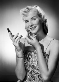 Studio portrait of a young woman applying lipstick, elegant poster print.