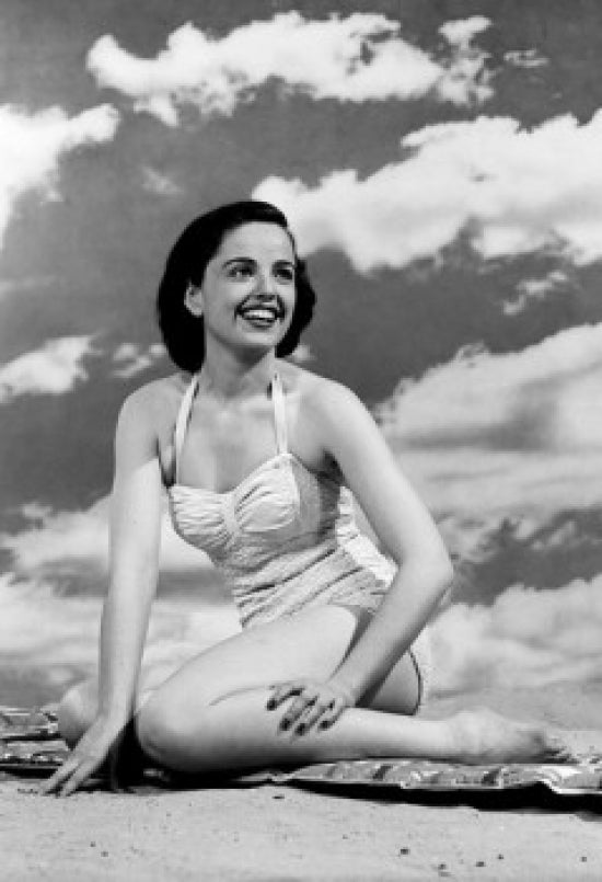 Young woman sitting on the beach poster print, serene coastal artwork.