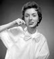 Portrait of woman cleaning teeth poster print showing self-care moment.