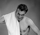 Portrait of man drying himself with towel poster print