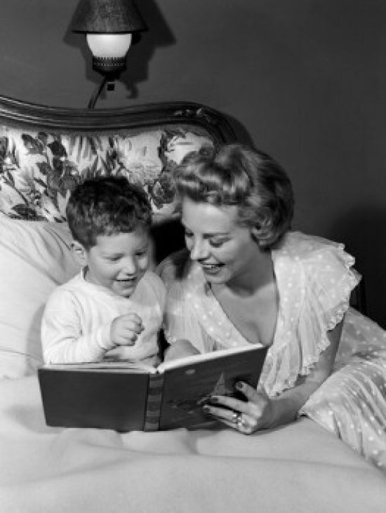 Mother Reading to Son in Bed Poster Print