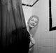 Portrait of young woman in shower poster print.