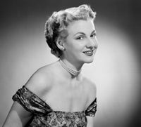 Portrait of a young woman in a dress and pearl necklace poster print.