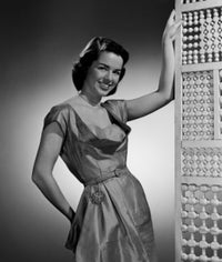 Portrait of young woman leaning against screen partition poster print.