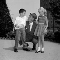 Grandfather talking to grandson and granddaughter poster print