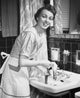 Portrait of a young woman hand washing clothes in the bathroom sink poster print.