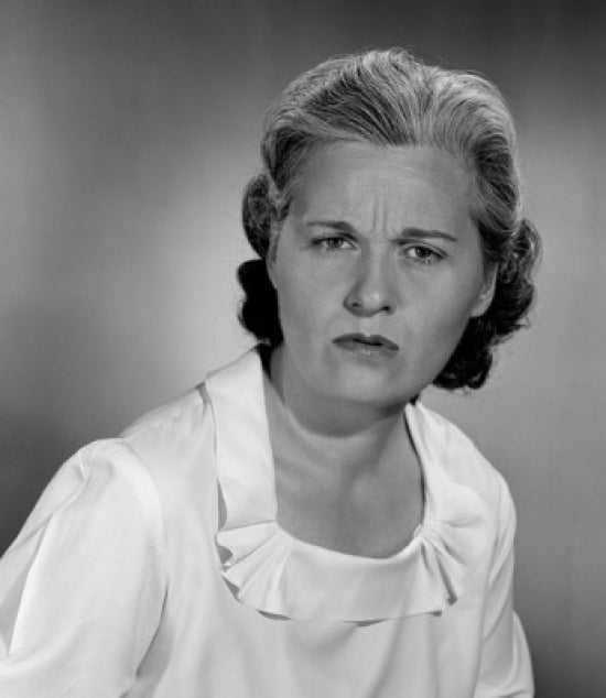 Studio portrait of a mid adult woman poster print showcasing elegance and beauty.